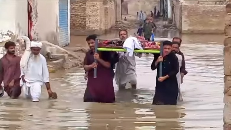 WATCH: Funeral procession passes through accumulated rainwater in Larkana