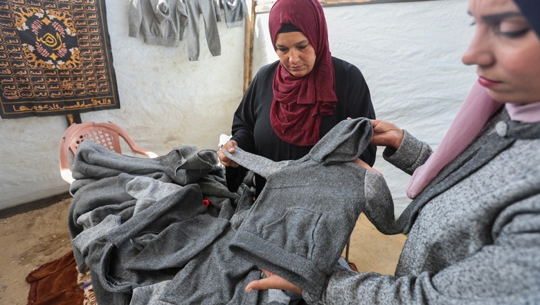 Gazans turn blankets into winter clothes through 'Needle and Thread' initiative
