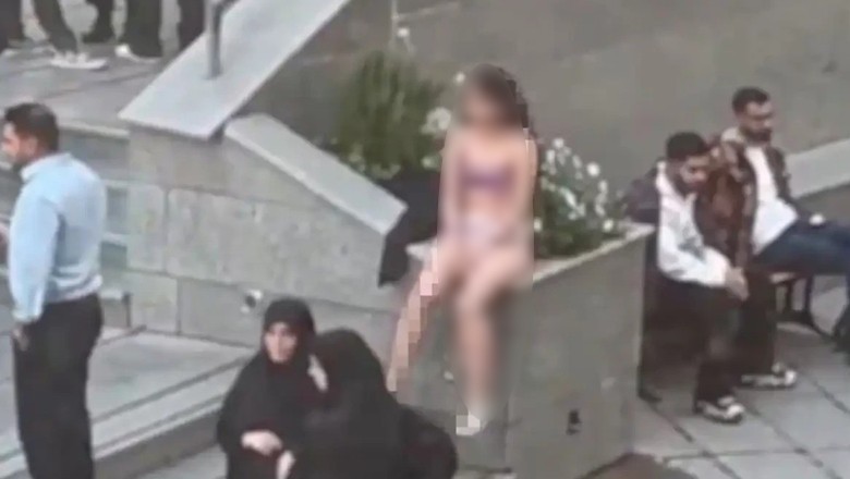 Iran woman strips at Tehran University to record her protest against Hijab