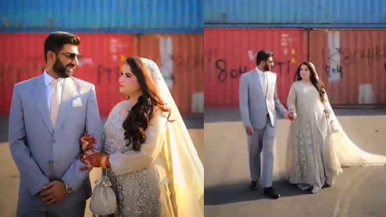Couple poses for wedding shoot in front of containers